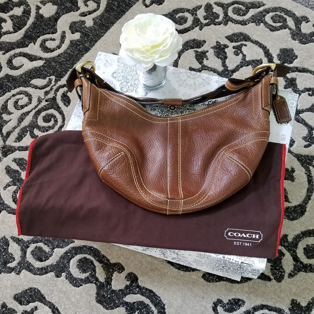 Like New Coach brown leather braided handbag.